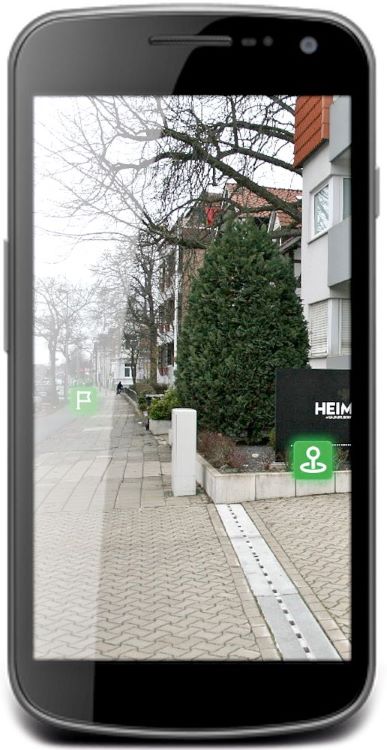 Auf einem Handydisplay sind ein Gehweg an Wohnhäusern entlang sowie zwei Markierungen zu sehen.